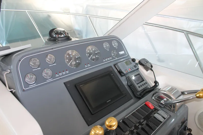 Slide: The Image of 1998 Tiara Yachts 2900 Coronet dashboard with gauges and navigation equipment. - 13