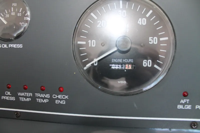 Slide: The Image of Dashboard of 1998 Tiara Yachts 2900 Coronet showing engine hours and indicators. - 18