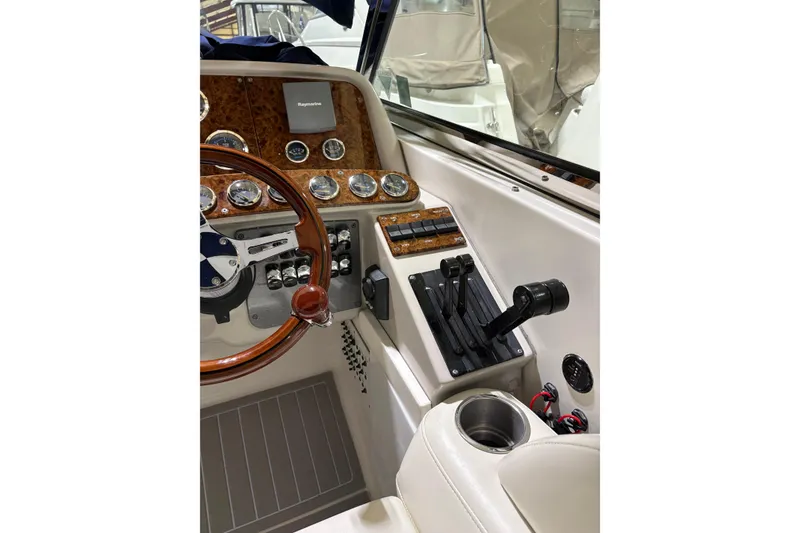 Slide: The Image of Dashboard of a 2004 Formula 400 Super Sport boat with steering wheel and controls. - 12