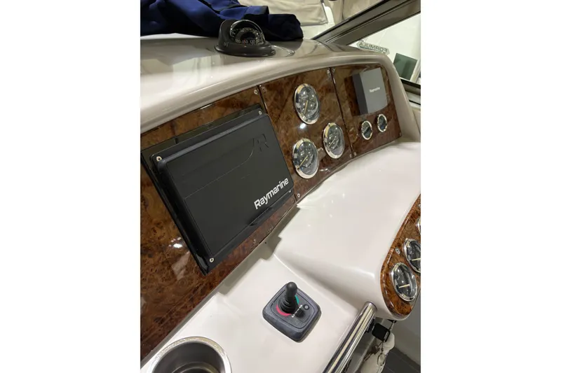 Slide: The Image of Dashboard of a 2004 Formula 400 Super Sport boat with Raymarine navigation system. - 14