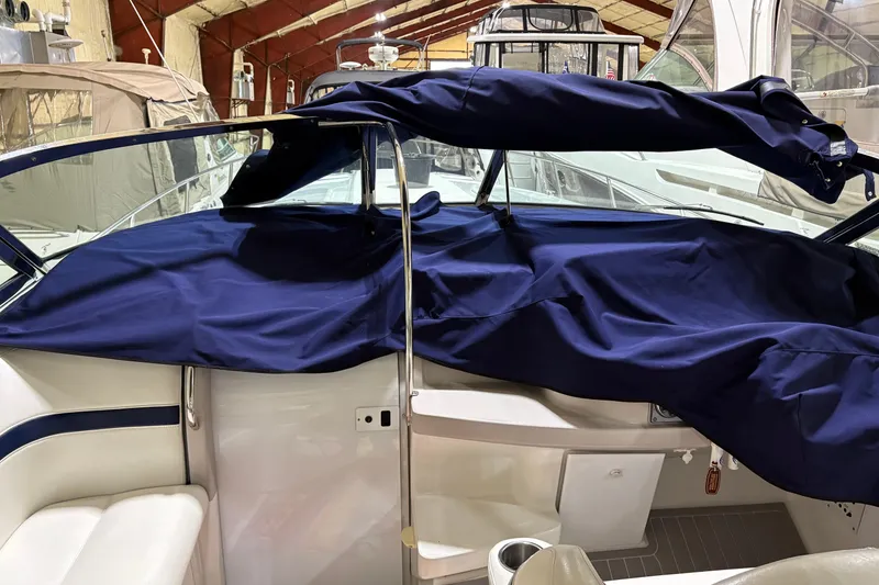 Slide: The Image of 2004 Formula 400 Super Sport boat interior with blue cover in storage. - 16