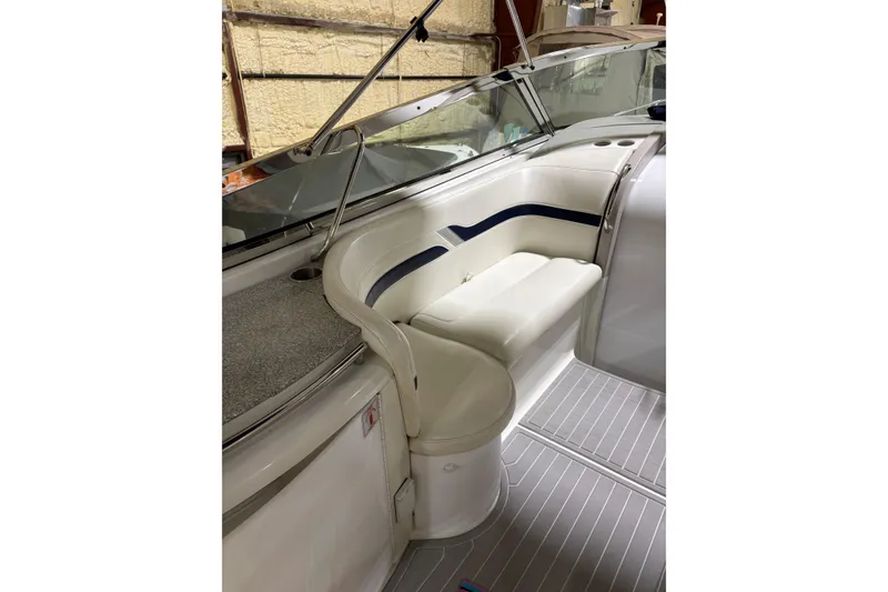 Slide: The Image of 2004 Formula 400 Super Sport boat interior with white seating and sleek design. - 18