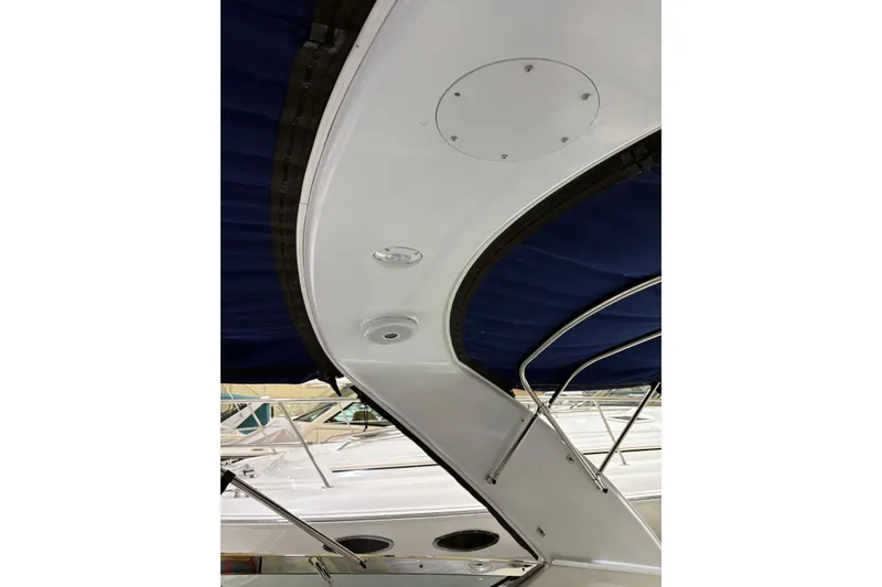 Slide: The Image of 2004 Formula 400 Super Sport boat interior with blue canopy and sleek design. - 27