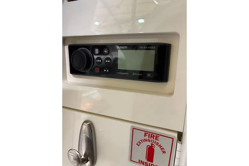 Slide: The Image of Control panel on a 2004 Formula 400 Super Sport boat with fire extinguisher sign. - 28