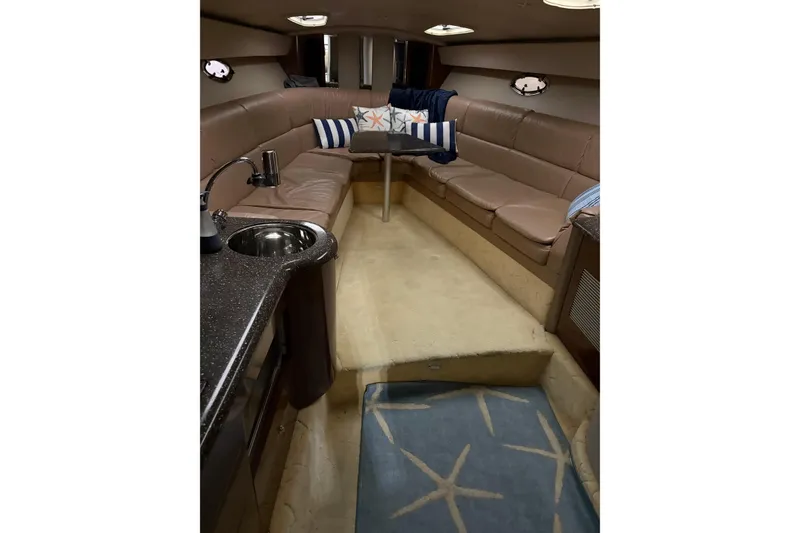 Slide: The Image of Interior of 2004 Formula 400 Super Sport yacht with plush seating and compact kitchenette. - 29