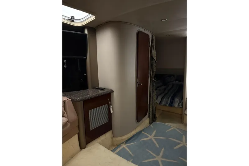 Slide: The Image of Interior of 2004 Formula 400 Super Sport boat with cozy cabin and modern amenities. - 35