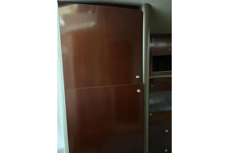 Slide: The Image of Wooden cabinetry inside a 2004 Formula 400 Super Sport boat interior. - 36