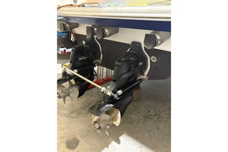 Slide: The Image of 2004 Formula 400 Super Sport boat with dual propeller drives in a garage setting. - 45