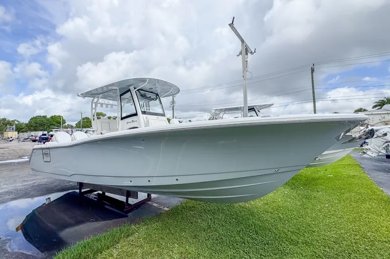 Slide: The Image of 2026 Sea Hunt Gamefish 30 boat displayed on grass. - 3