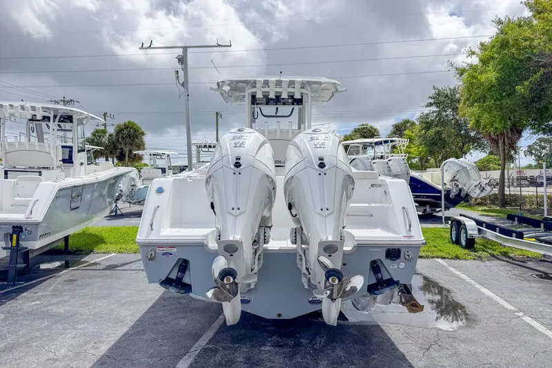 Slide: The Image of 2026 Sea Hunt Gamefish 30 with dual engines in parking lot. - 6