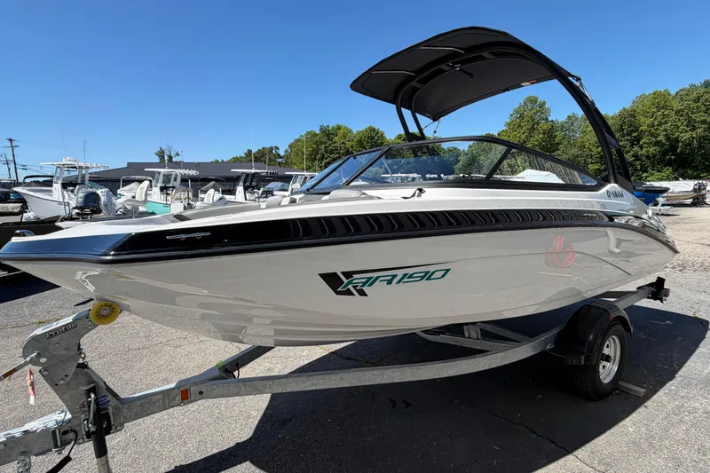 Slide: The Image of 2026 Yamaha Boats AR190 on trailer, sleek design, parked outdoors. - 12
