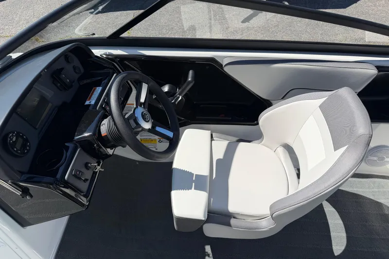 Slide: The Image of 2026 Yamaha Boats AR190 cockpit with steering wheel and captain's chair. - 15