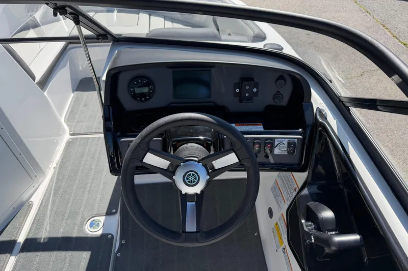 Slide: The Image of 2026 Yamaha Boats AR190 dashboard with steering wheel and control panel. - 16