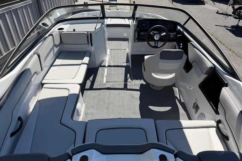 Slide: The Image of 2026 Yamaha Boats AR190 interior with sleek seating and modern dashboard design. - 19
