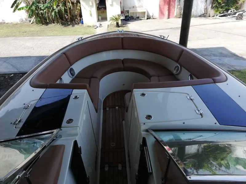 Slide: The Image of Interior view of a 2014 Chris-Craft Launch 32 boat with brown seating. - 11