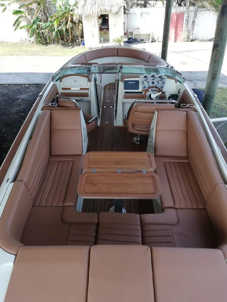 Slide: The Image of 2014 Chris-Craft Launch 32 boat interior with tan leather seating. - 12