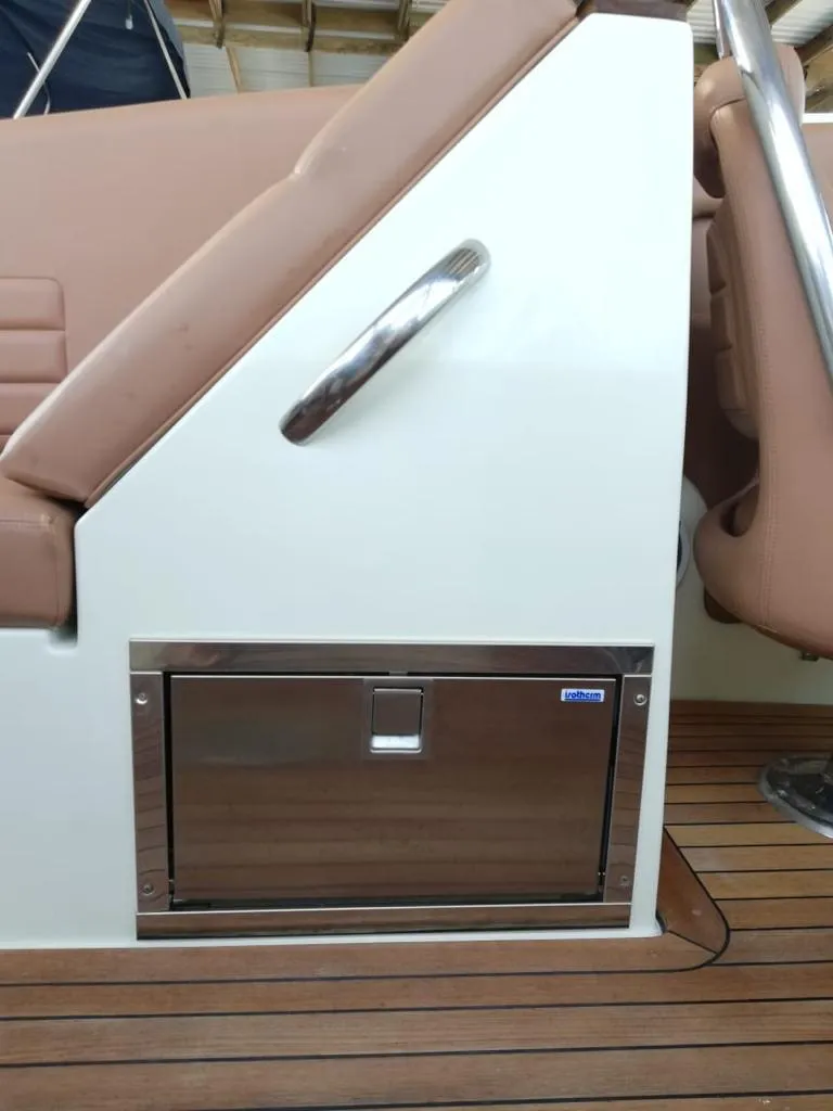 Slide: The Image of Chris-Craft Launch 32, 2014, interior with wood paneling and storage compartment. - 14