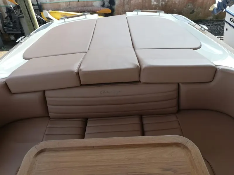 Slide: The Image of Interior of a 2014 Chris-Craft Launch 32 with brown upholstery. - 16