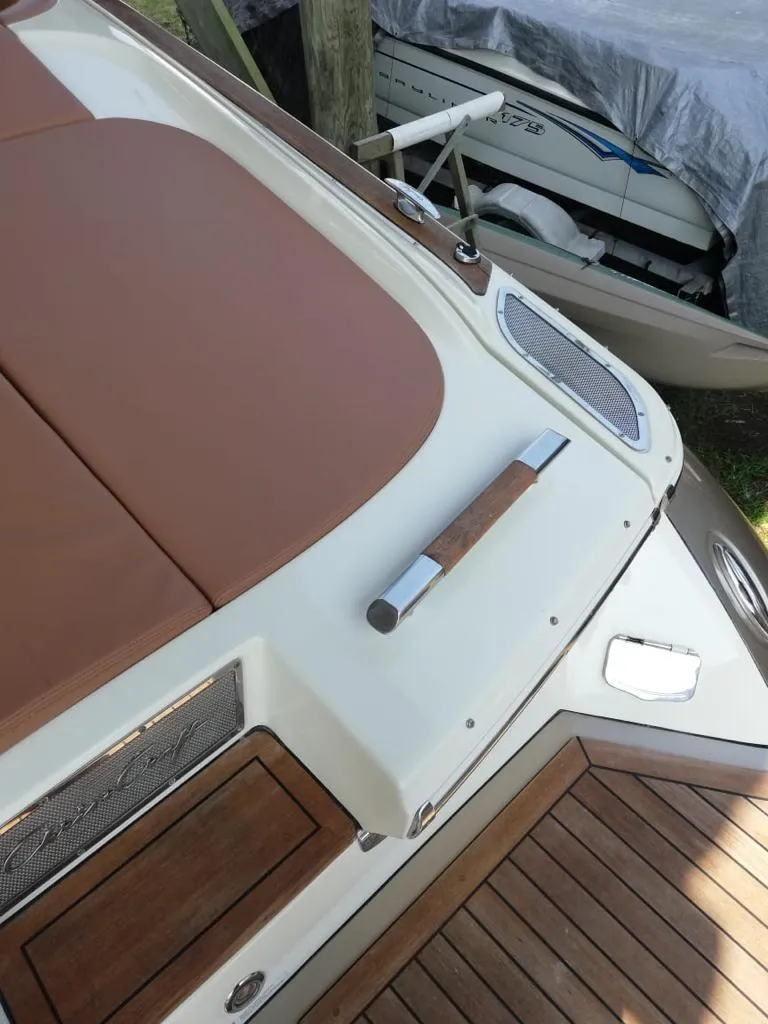 Slide: The Image of 2014 Chris-Craft Launch 32 boat deck with wood accents. - 17