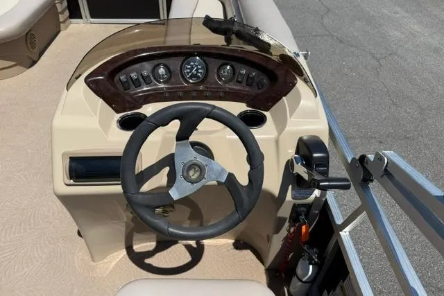 Slide: The Image of Steering console of a 2010 Bennington 20SLi pontoon boat with gauges and controls. - 15