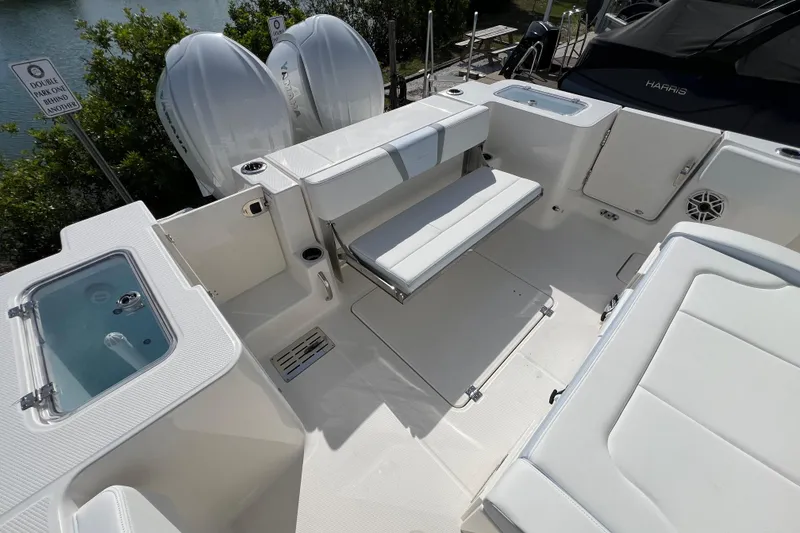 Slide: The Image of 2026 Robalo R300 Center Console boat interior with seating and storage compartments. - 10