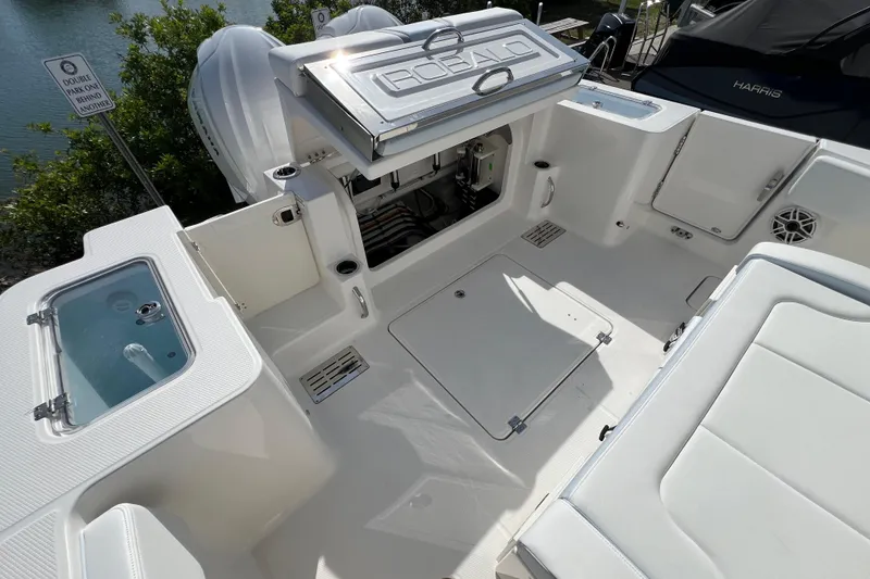 Slide: The Image of 2026 Robalo R300 Center Console boat interior with storage and seating areas. - 11