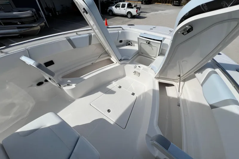 Slide: The Image of 2026 Robalo R300 Center Console boat interior with open storage compartments. - 32