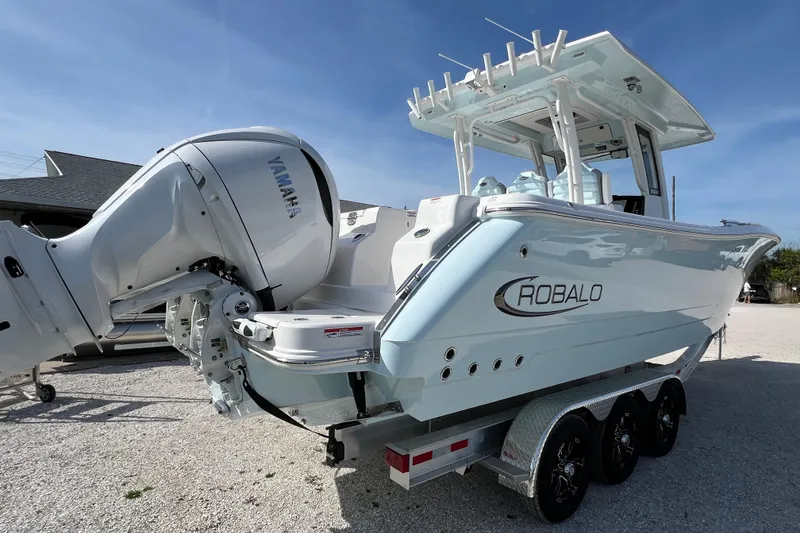 Slide: The Image of 2026 Robalo R300 Center Console boat with Yamaha engine on a trailer. - 5