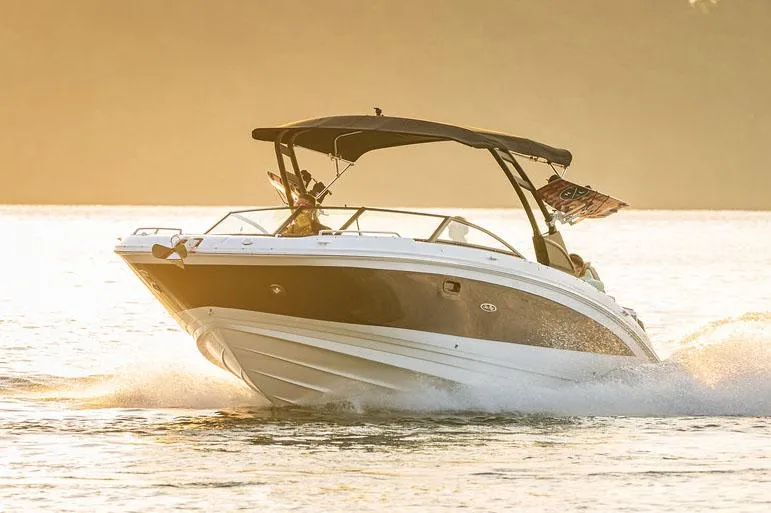 Slide: The Image of Manufacturer Provided Image: 2025 Sea Ray SDX 290 boat cruising on sunlit water. - 2