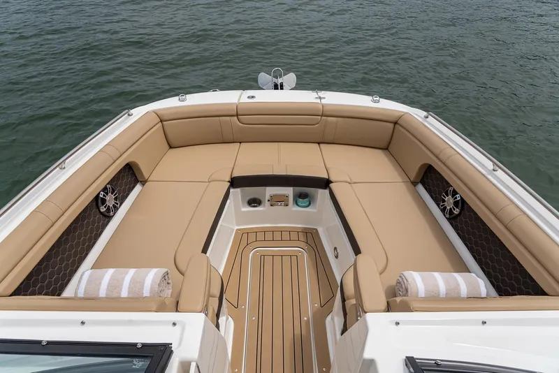 Slide: The Image of Manufacturer Provided Image: 2025 Sea Ray SDX 290 boat interior with tan seating and wood flooring. - 7