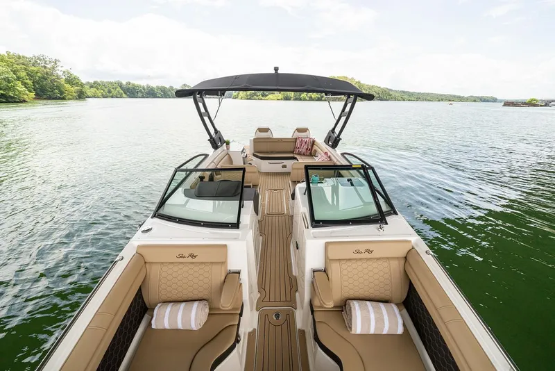Slide: The Image of Manufacturer Provided Image: 2025 Sea Ray SDX 290 boat on a serene lake, featuring luxurious seating and modern design. - 8