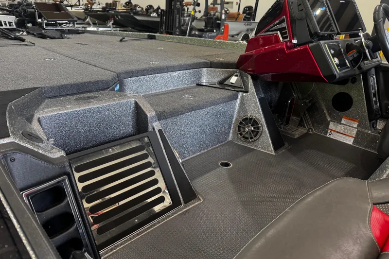 Slide: The Image of 2022 Ranger Z520R boat interior with modern dashboard and seating. - 13