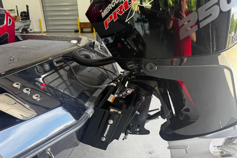 Slide: The Image of 2022 Ranger Z520R boat with Mercury Pro XS 250 engine in a garage setting. - 16