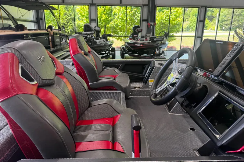 Slide: The Image of 2022 Ranger Z520R boat interior with red and black seats, steering wheel, and navigation display. - 3
