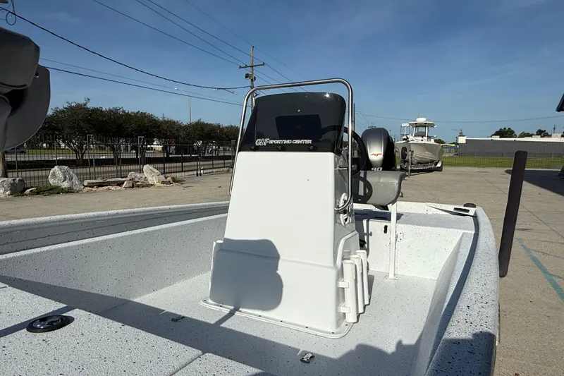 Slide: The Image of 2021 Alumaweld Xpress boat with center console and outboard motor in a parking area. - 14