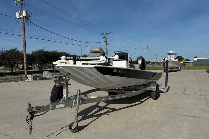 Slide: The Image of 2021 Alumaweld Xpress boat on trailer in outdoor parking lot. - 5