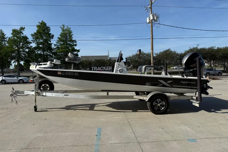 Slide: The Image of 2021 Alumaweld Xpress boat on trailer in outdoor setting. - 6