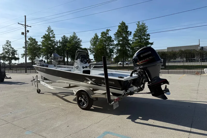 Slide: The Image of 2021 Alumaweld Xpress boat with Yamaha engine on trailer in outdoor setting. - 7