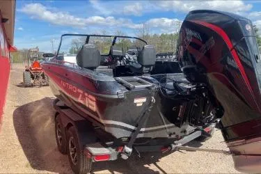Slide: The Image of 2021 Nitro ZV19 boat with powerful outboard motor on a trailer. - 9