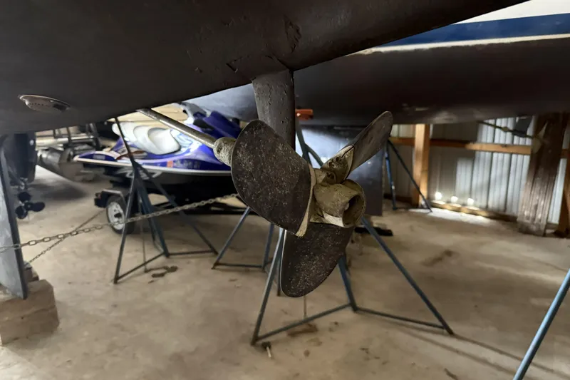 Slide: The Image of Propeller of a 1977 Islander 32 sailboat in a storage facility. - 23