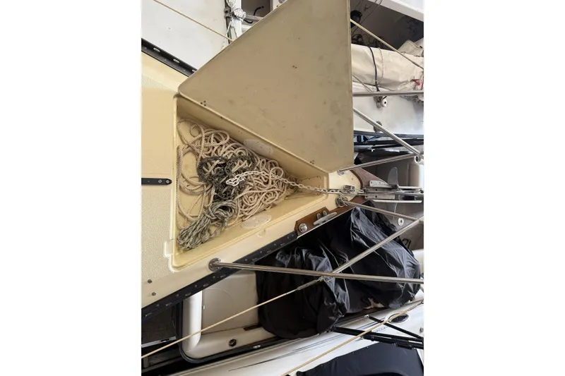 Slide: The Image of Anchor locker of a 1977 Islander 32 sailboat with ropes and chains. - 25