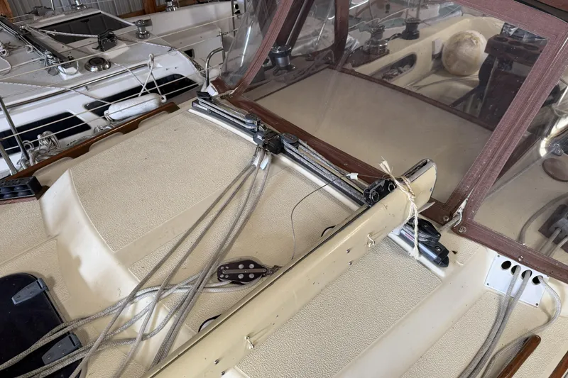 Slide: The Image of 1977 Islander 32 sailboat deck with rigging and cockpit details. - 8