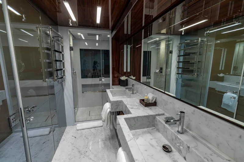 Slide: The Image of Luxurious bathroom interior on 2020 Riva 110' Dolcevita yacht, featuring marble countertops and modern fixtures. - 10