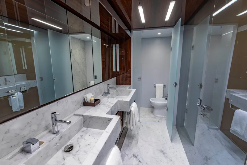 Slide: The Image of Luxurious bathroom on 2020 Riva 110' Dolcevita yacht with marble countertops and modern fixtures. - 11