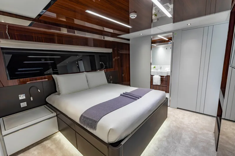 Slide: The Image of Luxurious bedroom interior of 2020 Riva 110' Dolcevita yacht with modern design and elegant furnishings. - 13