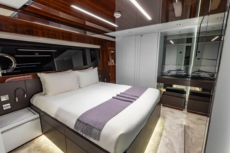 Slide: The Image of Luxurious bedroom interior on 2020 Riva 110' Dolcevita yacht with modern design and elegant furnishings. - 16
