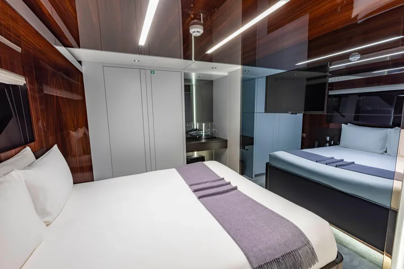 Slide: The Image of Luxurious bedroom interior of 2020 Riva 110' Dolcevita yacht with modern design and elegant furnishings. - 17