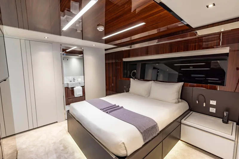 Slide: The Image of Luxurious bedroom interior on 2020 Riva 110' Dolcevita yacht, featuring modern design and elegant finishes. - 19