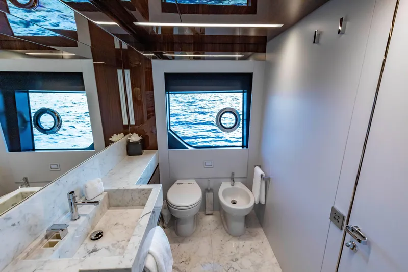 Slide: The Image of Luxurious bathroom on 2020 Riva 110' Dolcevita yacht with marble fixtures and ocean view. - 21