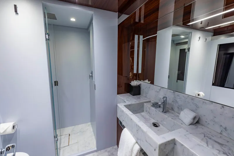 Slide: The Image of Luxurious bathroom on 2020 Riva 110' Dolcevita yacht with marble sink and glass shower. - 23